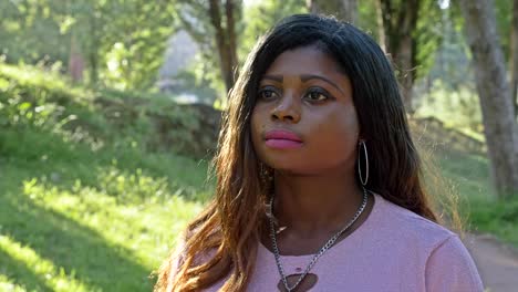 Thoughtful-sad-lonely-african-american-woman-thinking-at-the-park