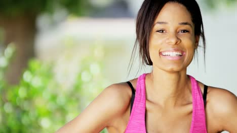 Portrait-smiling-African-American-girl-wearing-workout-clothing