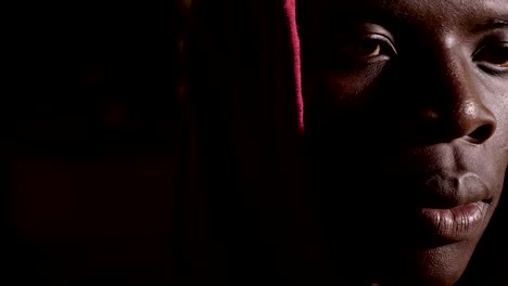 discrimination,-racism.Sad-lonely-young-hooded-black-african-man-in-the-dark