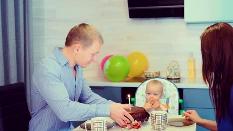 Little-cute-babe-blows-out-a-candle