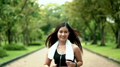 Young-lovely-woman-running-for-exercise-in-nature-park