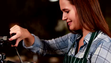 Smiling-waitress-making-cup-of-coffee