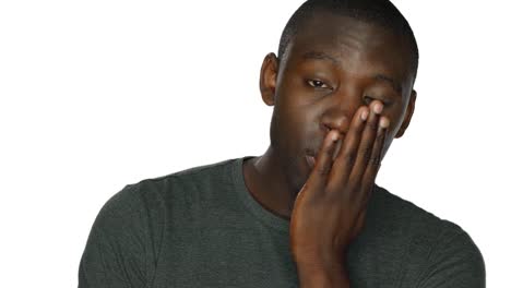 Young-man-looks-around-sadly,-on-a-white-studio-background