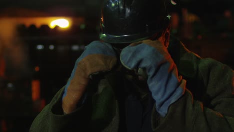 Portrait-of-Heavy-Industry-Technician-Putting-on-Safety-Glasses.-Rough-Industrial-Environment.