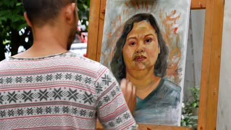 Artist-painting-portrait-of-asian-woman