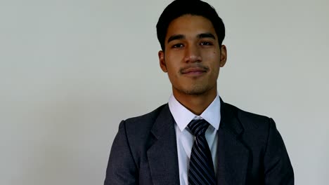 business,-people,-success,-happiness-and-cheerful-concept---smiling-young-man-startup-entrepreneur-businessman-wearing-gray-suit-with-white-background