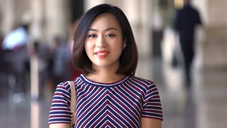 Smiling-happy-chinese-woman:-asian,-city,-outdoor,-portrait,