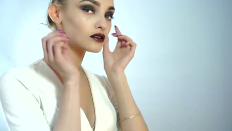 Glamrou-young-girl-with-beautiful-make-up-and-healthy-skin-posing-on-camera