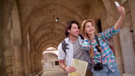 Young-tourists-taking-a-selfie-in-a-picturesque-medieval-town