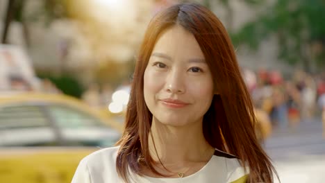 Attractive-Chinese-Woman-in-Urban-Environment.-Looking-at-the-Camera-with-Dark-Eyes-and-Dyed-Hair.