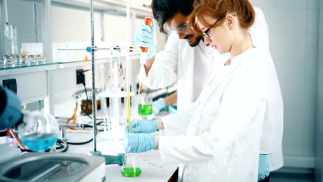 Young-students-of-chemistry-working-in-laboratory