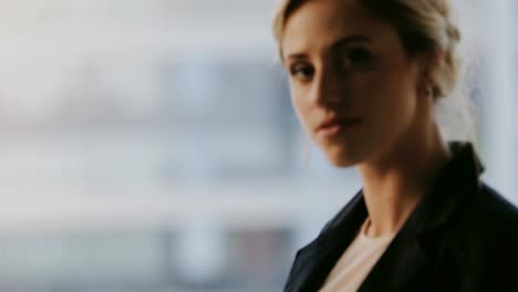 Portrait-of-young-woman-in-classical-suit-turn-face-in-high-floor-balcony