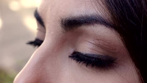 pensive-Asian-woman's-eyes-profile---outdoor--Macro