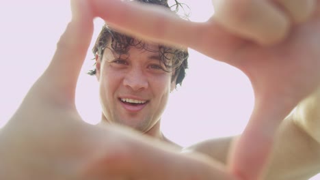 Portrait-Asian-Chinese-male-framing-face-with-fingers