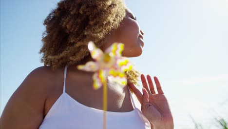 Portrait-of-Ethnic-female-enjoying-summer-on-beach