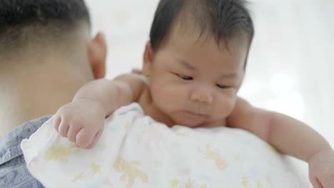 4K-Slow-motion-Happy-Asian-father-take-care-his-newborn-baby