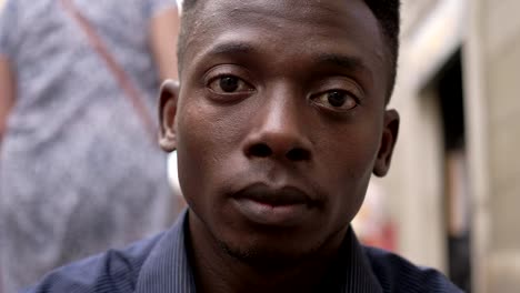 close-up-portrait-of-sad-desperate-young-black-man-raising-his-head-and-staring-at-camera