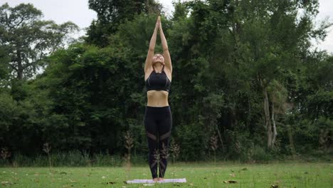 Beautiful-woman-is-doing-Yoga-in-Park