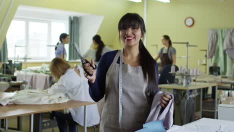 Portrait-of-Cheerful-Seamstress-at-Work