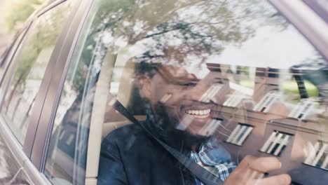 Handsome-Black-Man-Traveling-in-a-Car,-Sitting-on-a-Passenger-Seat-Uses-Smartphone,-Wins-Big-and-Celebrates-Success-with-YES-Gesture.-Camera-Shot-from-Outside-the-Vehicle.