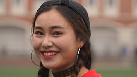 Side-view-of-Asian-college-girl-smile-4k