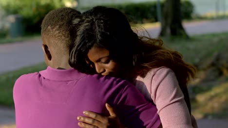 affection,comfort,love.-Young-american-african-lovers-hugging-in-the-park
