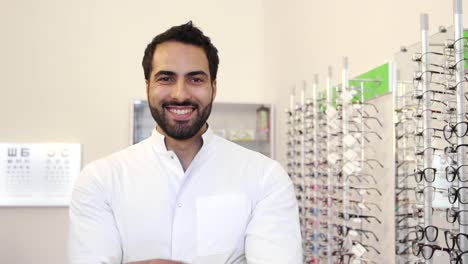 Optician-Doctor-Near-Showcase-With-Eyeglasses-At-Glasses-Shop