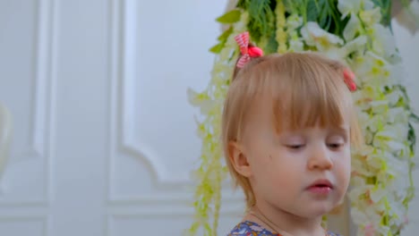 Portrait-of-funny-little-girl-at-home