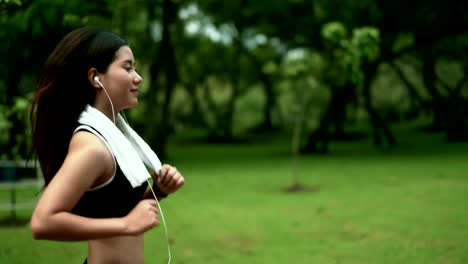 Young-pretty-woman-running-for-exercise-in-nature-park