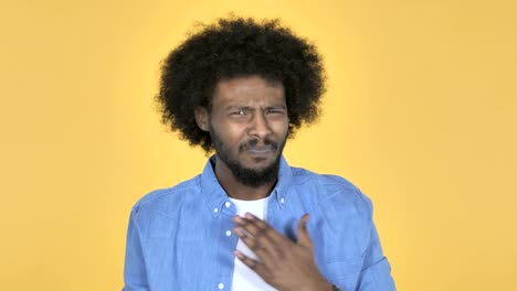 Sick-Afro-American-Man-Coughing-on-Yellow-Background