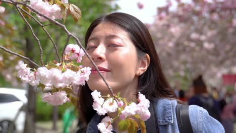 closeup-view-of-girl-smelling-flowers-joyfully