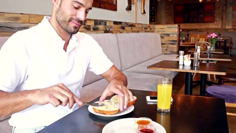 Happy-man-buttering-his-bread