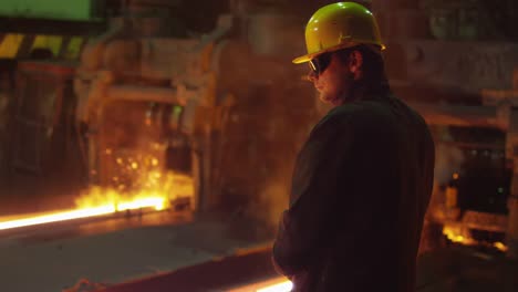 Portrait-of-Heavy-Industry-Technician-in-Hard-Hat-in-Foundry.-Industrial-Environment.