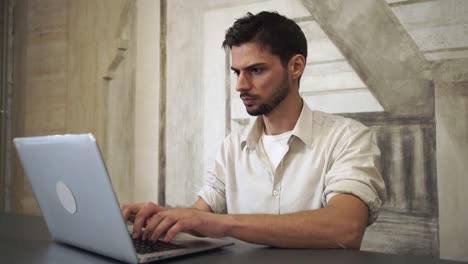 Mixed-race-businessman-working-on-the-computer