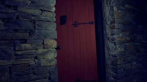 4k-Halloween-Shot-of-Red-Riding-Hood-Opening-Door-with-a-Knife,-horror-shot