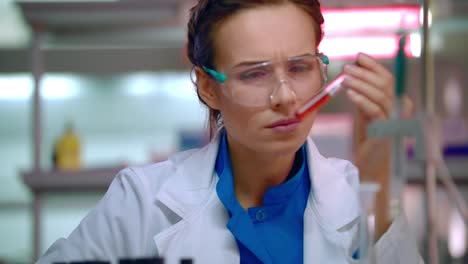 Woman-chemist-doing-chemical-test-in-chemistry-laboratory.-Chemist-working