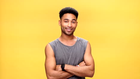 Young-happy-african-man-over-yellow-background.