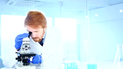 Scientist-Using-Microscope-in-Laboratory