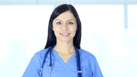 Portrait-of-Doctor-Looking-At-Camera-in-Clinic