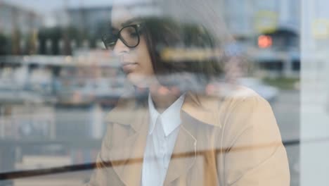 Woman-working-behind-the-window