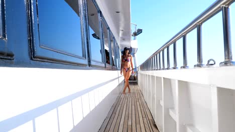 summer,-sea,-beautiful-sexy-young-brunette-woman-wearing-a-bathing-suit,-sun-hat-and-sunglasses,-walking-along-the-ferry-deck,-ship,-enjoying-the-rest,-the-beauty-of-the-sea,-happy,-smiling