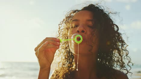 Happy-Young-Woman-Blowing-Bubbles