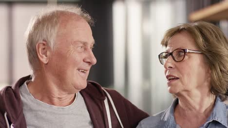 Portrait-of-attractive-Senior-Couple-talking-at-home