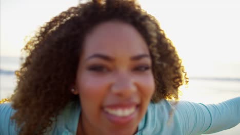 Portrait-of-Ethnic-female-enjoying-summer-on-beach