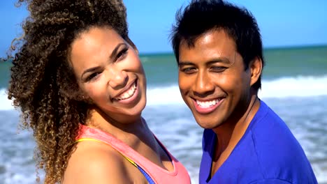 Portrait-of-multi-ethnic-couple-in-colourful-sportswear