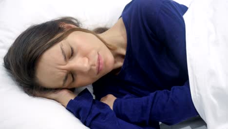 Coughing-Sick-Hispanic-Woman-Lying-in-Dark-Bedroom-at-Night