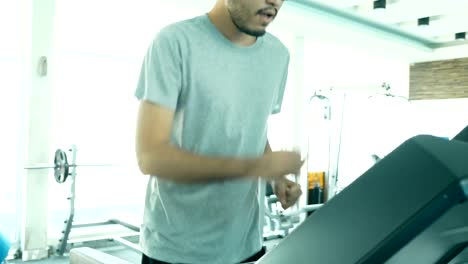 Asian-man-exercise-in-sport-gym.-People-with-sport-concept.