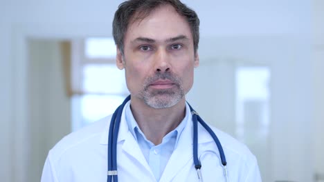 Portrait-of-Smiling-Doctor-in-Hospital