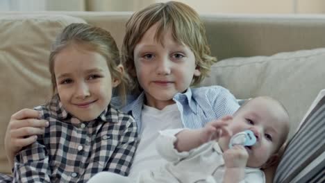 Children-with-Baby-Brother-Looking-at-Camera