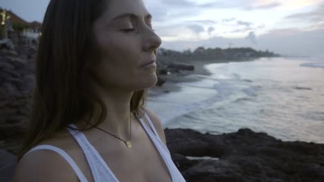 Woman-Meditating-on-Coastline